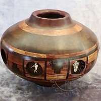 Van-Warren_segmented-pot-with-port-holes-carved-shamen-figures